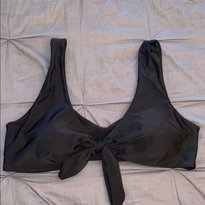 Black bikini top with tie in the middle.